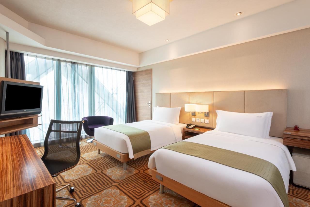 Holiday Inn Binhai Tianjin Habitación foto